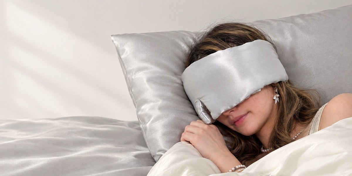 Debbie asleep in the Deep Sleep eye mask in Moonlight on a silk pillowcase